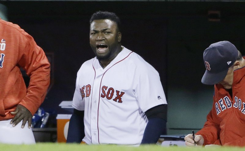 FILE - In this Oct. 10, 2016, file photo, Boston Red Sox designated hitter David Ortiz encourages the crowd from the dugout during the eighth inning in Game 3 of baseball's American League Division Series against the Cleveland Indians in Boston. Former Boston Red Sox slugger Ortiz was shot and wounded in his native Dominican Republic, his father told ESPN on Sunday, June 9, 2019. (AP Photo/Elise Amendola, File)

