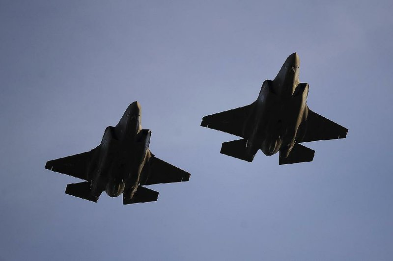 Air Force F-35A fighter jets fly over Levi’s Stadium in Santa Clara, Calif., in November before the start of a National Football League game. United Technologies makes engines for Lockheed Martin’s F-35s. 