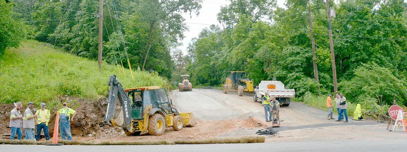 Keith Bryant/The Weekly Vista Workers at the intersection of East Plentywood Road and West McNelly Road lay down material to widen East Plentywood. Work at the intersection is expected to wrap up June 14, and closures are expected from 7:00 a.m. to 3:30 p.m. for the duration of the project. county officials have stated the widened intersection will provide better visibility and should be significantly safer.