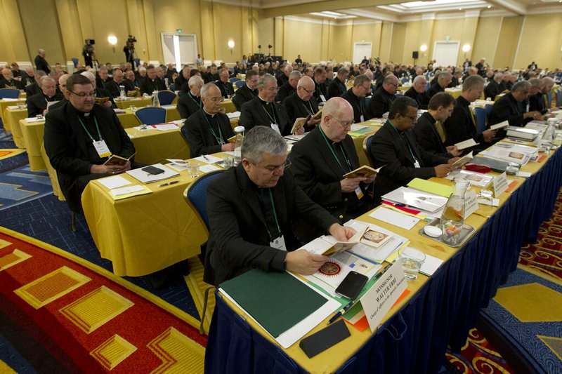 Catholic Bishops participate in a morning prayer, during the United States Conference of Catholic Bishops (USCCB), 2019 Spring meetings in Baltimore, Tuesday, Jun 11, 2019. (AP Photo/Jose Luis Magana)