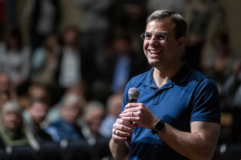 U.S. Rep. Justin Amash, R-Cascade Township, holds a town hall meeting at Grand Rapids Christian High School's DeVos Center for Arts and Worship on Tuesday, May 28, 2019. The congressman came under scrutiny May 18 when he posted a series of Tweets to outline his support for impeachment proceedings. As such, he is the only Republican congress member to do so. The following days brought an announcement from the wealthy DeVos family about no longer supporting him financially. (Cory Morse/The Grand Rapids Press via AP)

