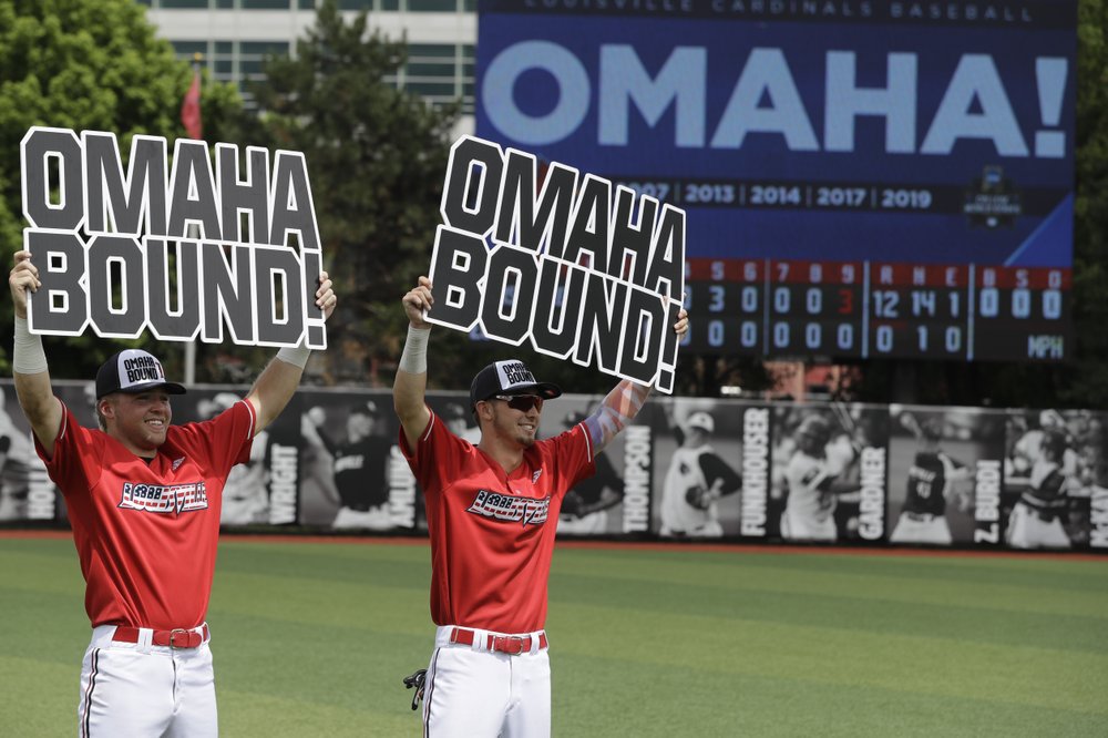 Louisville's Drew Campbell, right, celebrates with Alex Binelas