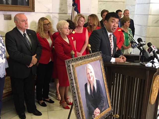 Ken Yang speaks in front of a group of Arkansas lawmakers during a remembrance ceremony at the state Capitol on Tuesday.