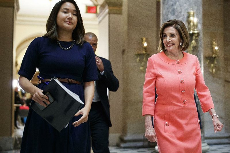 House Speaker Nancy Pelosi (D-Calif., right) walks from the House Chamber to her office following a vote aimed at authorizing the Judiciary Committee to go to court to enforce two subpoenas related to the Mueller Report, on Capitol Hill in Washington, June 11, 2019. 