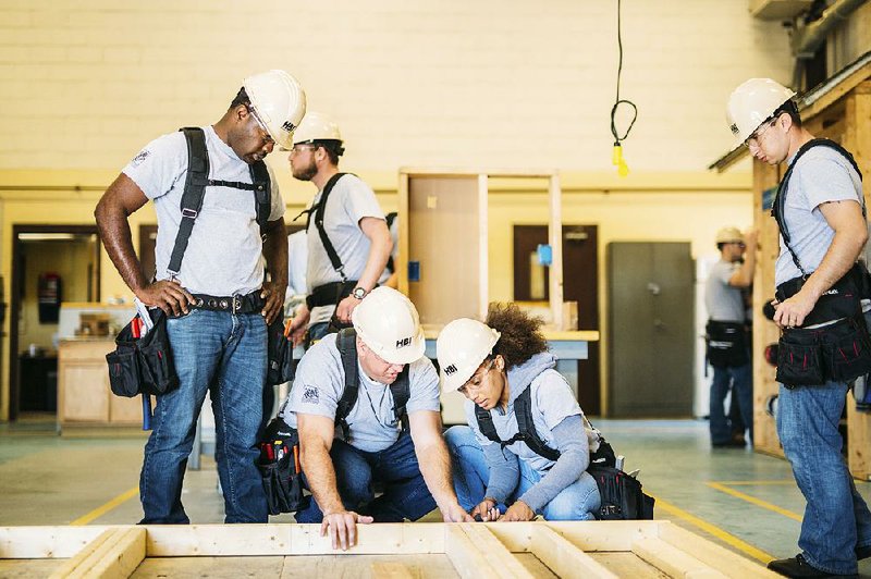 Students gain carpentry experience at a training session sponsored by The Home Depot Foundation the and Home Builders Institute  this spring in Fort Stewart, Ga. The U.S. construction industry will need an additional 747,000 workers by 2026, the U.S. Bureau of  Labor Statistics says. 