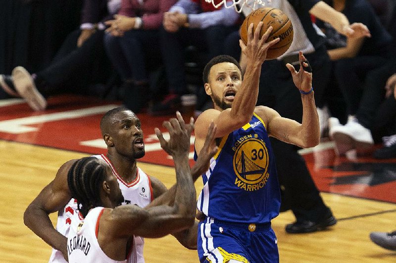 Golden State guard Stephen Curry (30) scored 31 points to lead the Warriors to a 106-105 victory over the Toronto Raptors in Game 5 of the NBA Finals. Game 6 is Thursday night in Oakland, Calif. 