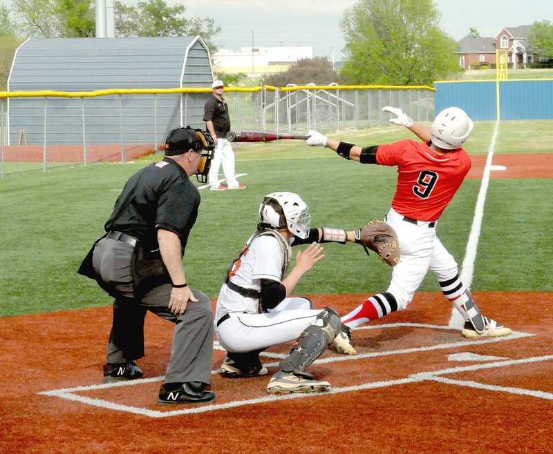 MARK HUMPHREY ENTERPRISE-LEADER Farmington freshman Trey Hill got all of the first pitch he saw during the fourth inning. Hill blasted a 2-run homer in the Cardinals' 12-0 win over Gravette on Tuesday, April 23, during District 4A-1 tournament play on the Springdale campus of Shiloh Christian Schools. The win put the Cardinals into the 4A North Regional, which they hosted May 2-5.