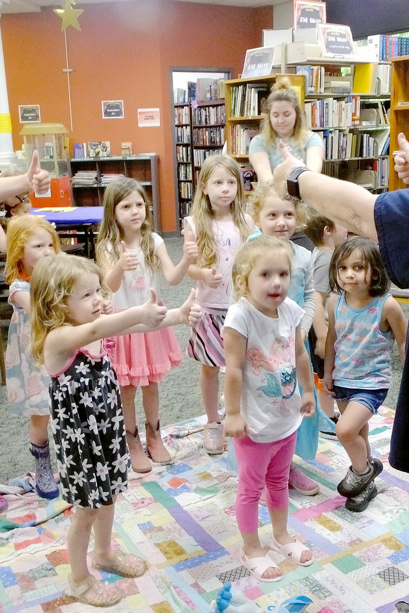 Lynn Atkins/The Weekly Vista Preschool storytime began with an interactive song last week. It goes on year-round at 10 a.m. on Fridays. Older kids, teens and adults can also participate in summer reading programs at the library.