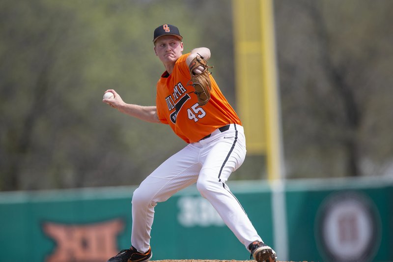 Bruce Waterfield/OSU Athletics Logan Gragg pitches during the Oklahoma State Cowboys vs. West Virginia Mountaineers baseball game, Sunday, April 7, 2019, at Allie P. Reynolds Stadium in Stillwater, Okla. Gragg is a 2016 graduate of Prairie Grove High School and becomes the third Tiger pitcher coached by Mitch Cameron and drafted by Major League Baseball since 2014. He was selected by the St. Louis Cardinals.