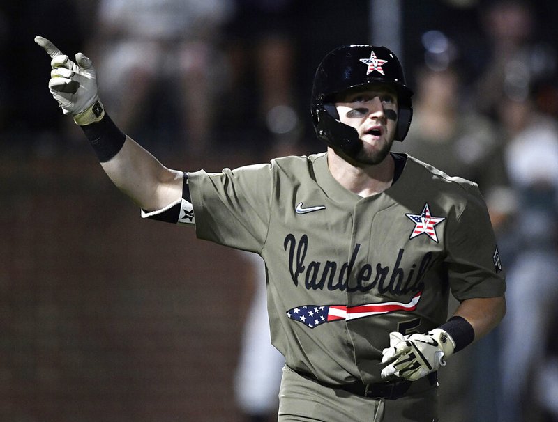 In this June 2, 2019, file photo, Vanderbilt's Philip Clarke (5) points to the sky after hitting a home run in the bottom of the fourth inning against Indiana State during an NCAA college baseball regional game in Nashville, Tenn. The College World Series has an even stronger Southeastern Conference flavor than usual. "The background on my phone is TD Ameritrade Park," said Vanderbilt catcher Philip Clarke, referring to the site of the College World Series. "That's definitely an expectation, to go there every year." (George Walker IV/The Tennessean via AP, File)