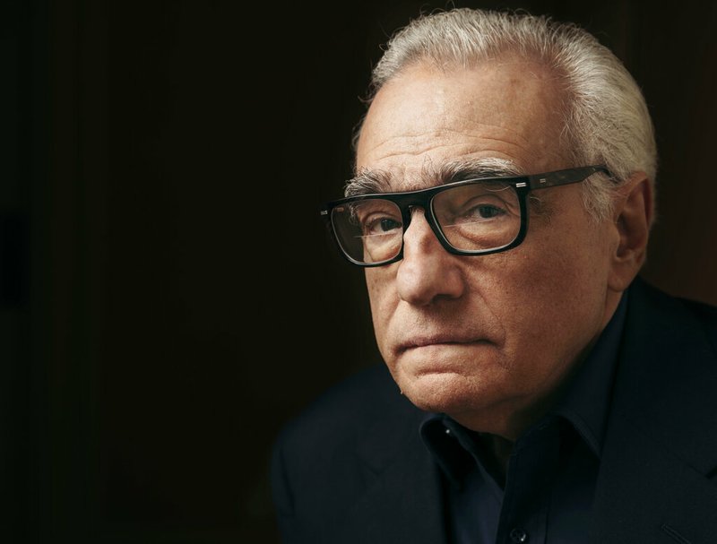 In this Dec. 9, 2016 file photo, producer and director Martin Scorsese poses for a portrait in New York. Scorsese's latest film, "Rolling Thunder Revue: A Bob Dylan Story By Martin Scorsese," is a blistering semi-fictional documentary that resurrects Dylan's mythic 1975-1976 tour and its rambling cavalcade across a post-Vietnam America. The film, which opens Wednesday in limited theaters and on Netflix, includes restored performance footage, scenes of the backstage circus and interviews with many of the participants, including Dylan's first on-camera interview in 10 years. (Photo by Victoria Will/Invision/AP, File)