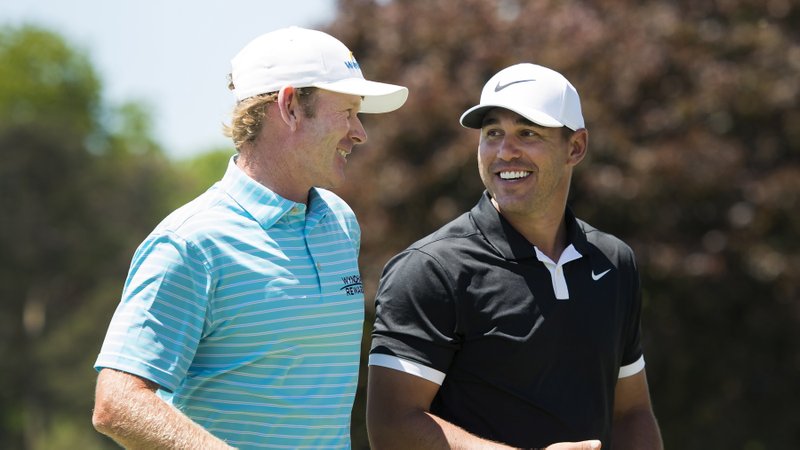  Brooks Koepka, right and Brandt Snedeker, left, laugh after finishing the second round on the ninth green at the 2019 Canadian Open golf tournament in Ancaster, Ontario, Friday, June 7, 2019. 