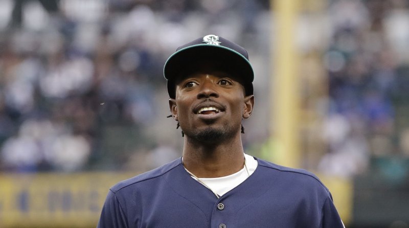 Seattle Mariners second baseman Dee Gordon reacts after completing a double play against the Detroit Tigers in the second inning of a baseball game Friday, May 18, 2018, in Seattle. 