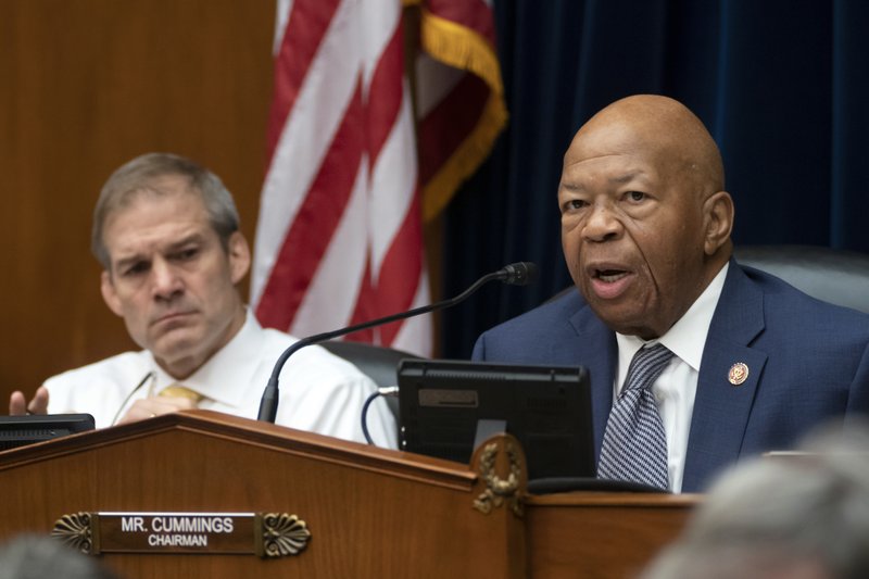 House Oversight and Reform Committee Chairman Elijah E. Cummings, D-Md., joined at left by Rep. Jim Jordan, R-Ohio, the ranking member, holds debate on whether to hold Attorney General William Barr and Commerce Secretary Wilbur Ross in contempt for failing to turn over subpoenaed documents related to the Trump administration's decision to add a citizenship question to the 2020 census, on Capitol Hill in Washington, Wednesday, June 12, 2019. (AP Photo/J. Scott Applewhite)

