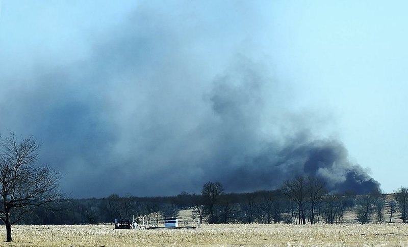 Smoke billows from the site of a gas well fire in January 2018 near Quinton, Okla., after an explosion and fire killed five workers at the well as a result of the failure of blowout prevention devices and other factors. 