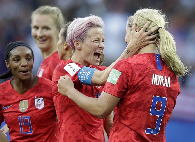 United States' scorer Lindsey Horan, right, celebrates their side's 3rd goal with Megan Rapinoe during the Women's World Cup Group F soccer match between United States and Thailand at the Stade Auguste-Delaune in Reims, France, Tuesday, June 11, 2019. (AP Photo/Alessandra Tarantino)