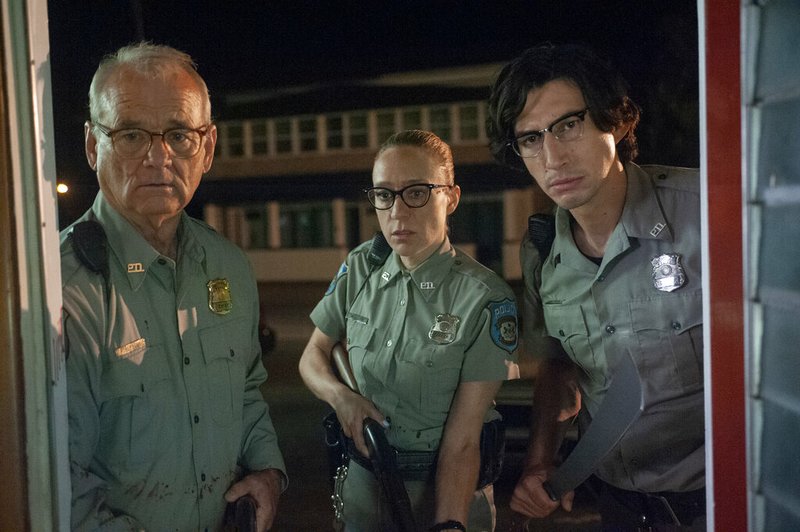 This image released by Focus Features shows Bill Murray, from left, Chlo&#235; Sevigny and Adam Driver in a scene from "The Dead Don't Die." (Abbot Genser/Focus Features via AP)