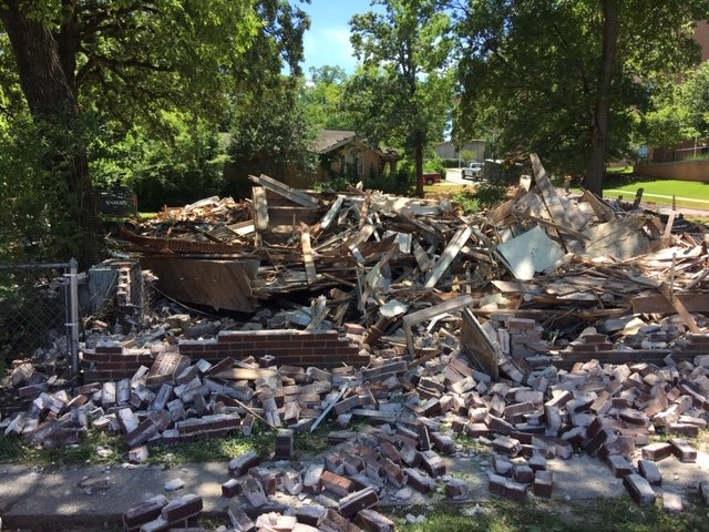 A demolished house on Plateau Street between Pine and Cedar Streets.