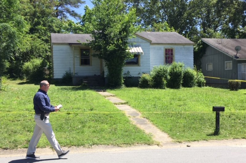 FILE — Little Rock police tape off a home in the 4600 block of West 16th Street, June 13, while investigating a triple homicide.