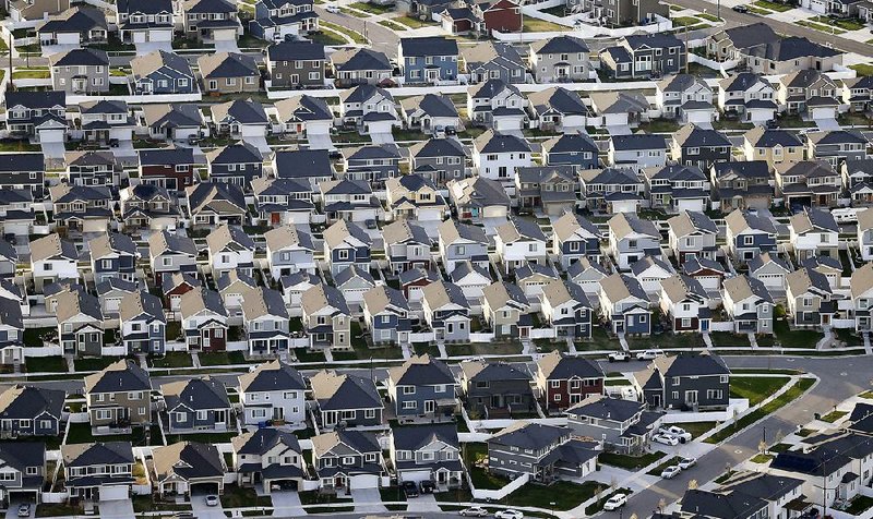 Rows of new homes fill a subdivision in suburban Salt Lake City in April. There are about 50 million residential properties in the United States, and $10 trillion in amassed debt, making the U.S. mortgage market the largest source of consumer lending in the world. 