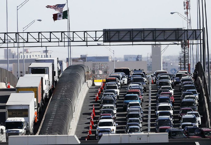 Vehicles line up to enter the U.S. from Mexico at a border crossing in El Paso, Texas, in March. Uncertainty about trade remains a concern for suppliers despite the suspension of a Trump administration plan to impose tariffs on all products from Mexico. 
