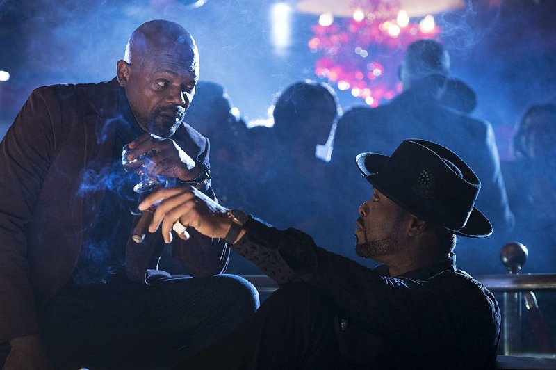 John Shaft (Samuel L. Jackson) checks in with his old friend and informant, Club Groover owner and Harlem Legend, Freddy P. (Cliff “Method Man” Smith) in Tim Story’s Shaft. 
