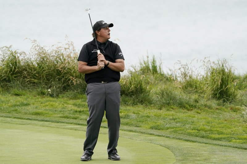 The Associated Press MISSED PUTT: Phil Mickelson reacts after missing a putt on the ninth hole Thursday during the first round of the U.S. Open Championship in Pebble Beach, Calif.