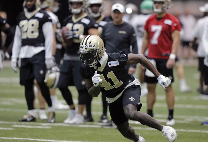 FILE - In this Tuesday, June 11, 2019, file photo, New Orleans Saints running back Alvin Kamara (41) runs a drill during NFL football practice in Metairie, La. Kamara says the offseason is a time for him to experiment with training methods and nutrition to improve as an athlete, and to continue studying pro football in hopes of adding new wrinkles to his already dynamic game. (AP Photo/Gerald Herbert, File)