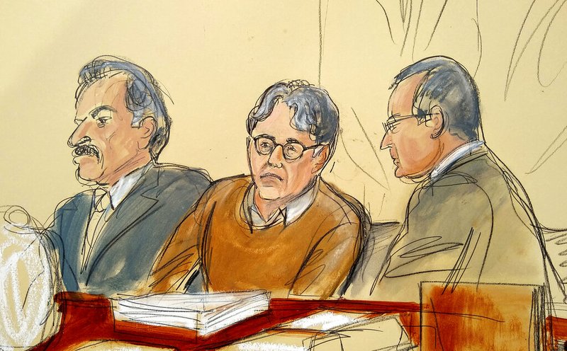 In this Tuesday, May 7, 2019 file courtroom drawing, defendant Keith Raniere, center, leader of the secretive group NXIVM, is seated between his attorneys Paul DerOhannesian, left, and Marc Agnifilo during the first day of his sex trafficking trial. (Elizabeth Williams via AP, File)