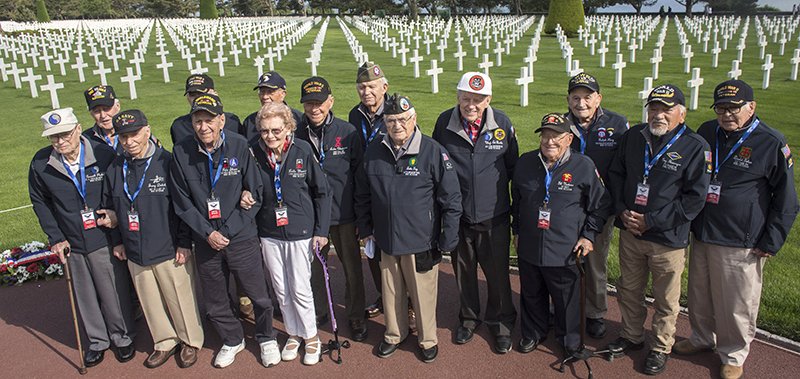 The Associated Press D-DAY: World War II veterans from the United States, including Ralph King, of Hot Springs, third from right, gather at the Normandy American Cemetery in Colleville-sur-Mer, Normandy, France, on June 3. France this year marked the 75th anniversary of the D-Day invasion, which took place on June 6, 1944.