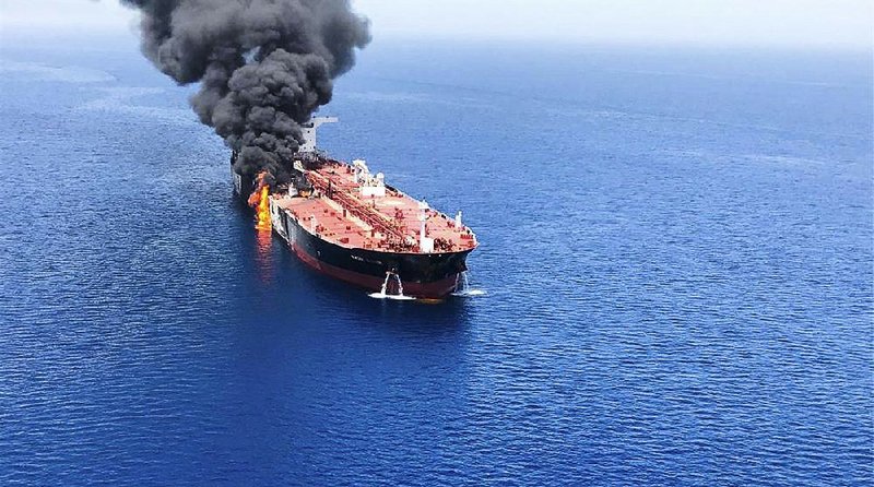 An oil tanker burns in the Gulf of Oman, one of two ships attacked Thursday near the Strait of Hormuz. 