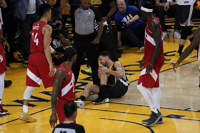 Klay Thompson of the Golden State Warriors goes down with a knee injury Thursday night during Game 6 of the NBA Finals. Although Thompson and Kevin Durant are both sidelined by injuries for an extended time, Warriors Coach Steve Kerr said the team’s future success is not in doubt.