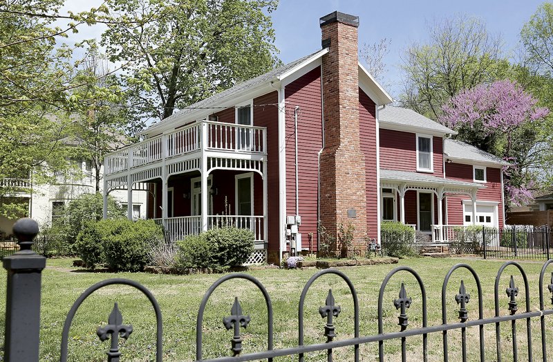  The Wade-Heerwagen House at 338 N. Washington Avenue is visible Friday, April 12, 2019, in the Washington-Willow district in Fayetteville. The city's Historic District Commission is working with a consultant on a draft of a preservation ordinance for the Washington-Willow Historic District. The ordinance would outline certain design standards to preserve the architectural character of the neighborhood while accommodating additions and modifications to existing homes and new developments.