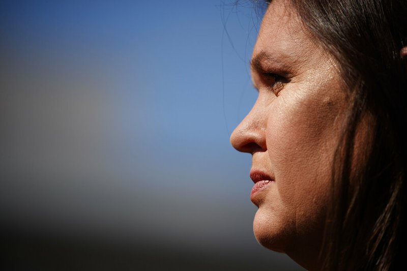 In this Friday, May 31, 2019, file photo White House press secretary Sarah Sanders talks to reporters outside the White House in Washington. (AP Photo/Evan Vucci, File)