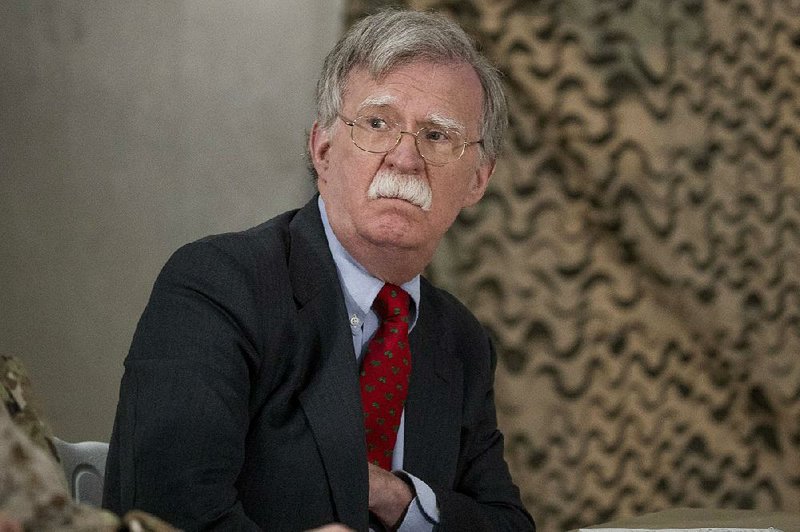National Security Adviser John Bolton attends a meeting with President Donald Trump and senior military leadership at Al Asad Air Base, Iraq, Wednesday, Dec. 26, 2018. 