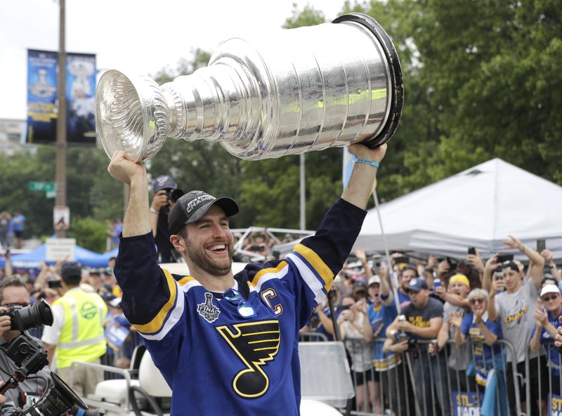 St. Louis Blues defenseman and captain Alex Pietrangelo carries the Stanley Cup during the Blues' NHL hockey Stanley Cup victory celebration in St. Louis on Saturday, June 15, 2019. (AP Photo/Darron Cummings)
