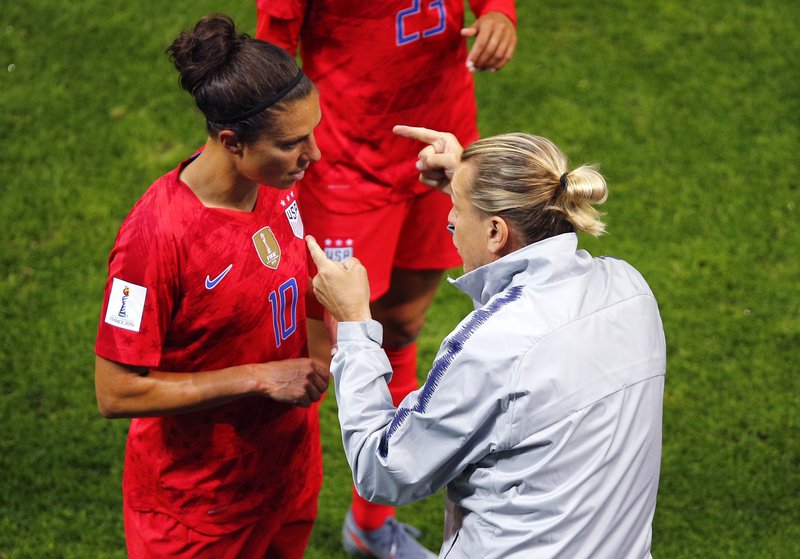 United States' coach Jill Ellis gestures as she talks to her player Carli Lloyd during the Women's World Cup Group F soccer match between the United States and Thailand at the Stade Auguste-Delaune in Reims, France, Tuesday, June 11, 2019. (AP Photo/Francois Mori)