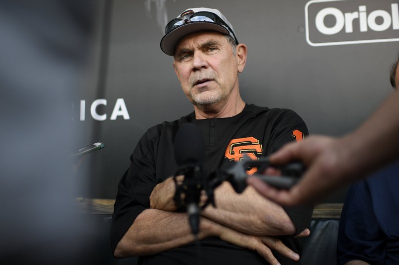 San Francisco Giants manager Bruce Bochy talks to the media in the dugout before a baseball game against the Baltimore Orioles, Friday, May 31, 2019, in Baltimore. 