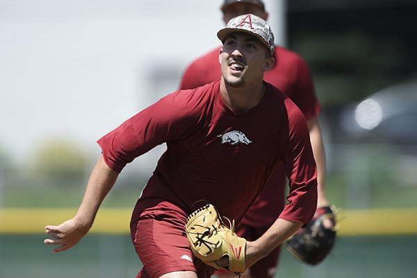 Arkansas pitcher Connor Noland fields during practice Sunday, June 16, 2019, at East High School in Bellevue, Neb.