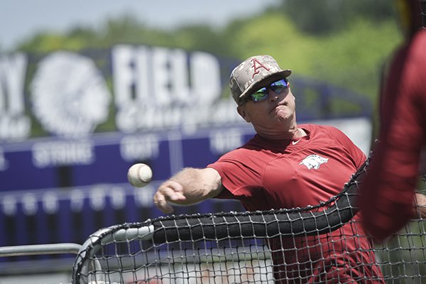 Arkansas coach Dave Van Horn throws batting practice on Sunday, June 16, 2019, at East High School in Bellevue, Neb.