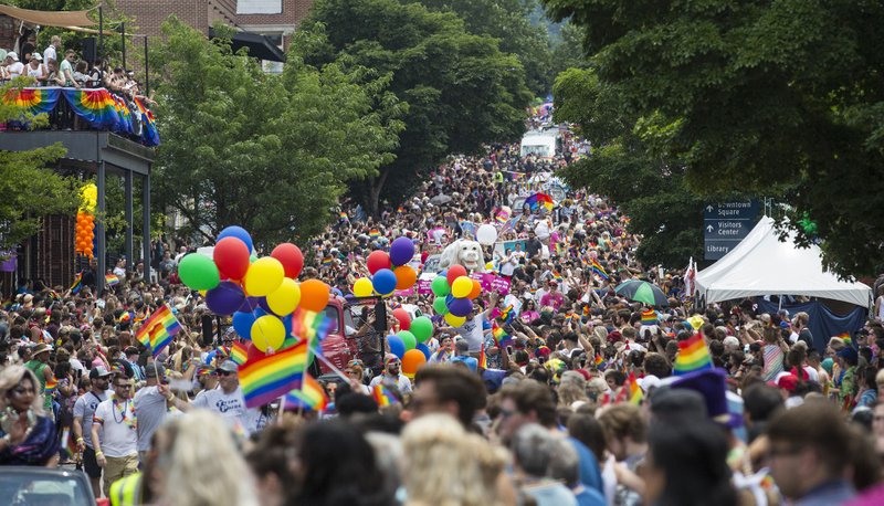 
The parade moves down Dickson Street Saturday, June 15, 2019, during the annual Northwest Arkansas Pride Festival  in Fayetteville. 