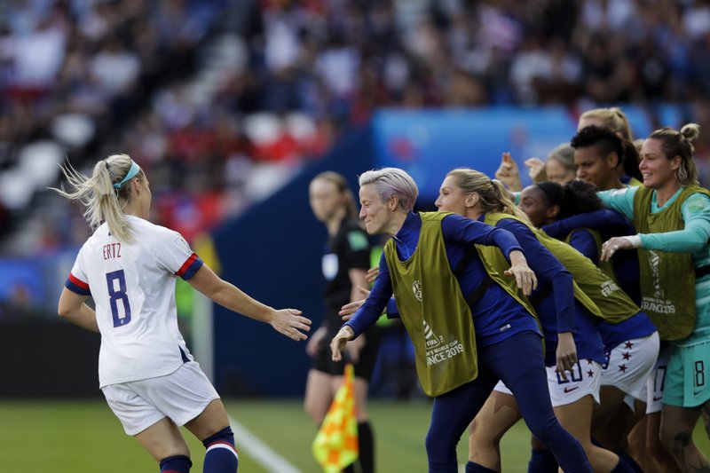 The Associated Press CELEBRATORY RUN: United States' Julie Ertz, left, celebrates with teammates after scoring the team's second goal during the Women's World Cup Group F soccer match Sunday against Chile at Parc des Princes in Paris, France.