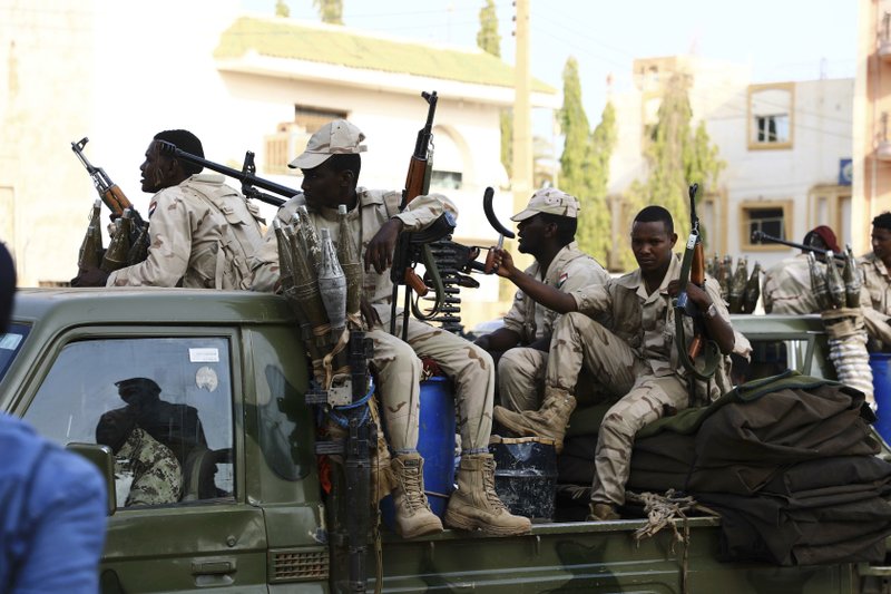 Military forces secure the area outside while Sudan's ousted president Omar al-Bashir is questioned at the prosecutor's office over charges of corruption and illegal possession of foreign currency, in Khartoum the capital of Sudan Sunday June 16, 2019. The deposed strongman has been held under arrest in the capital since the military removed him from power in April amid mass public protests against his 30-year rule.(AP Photo/Mahmoud Hjaj)