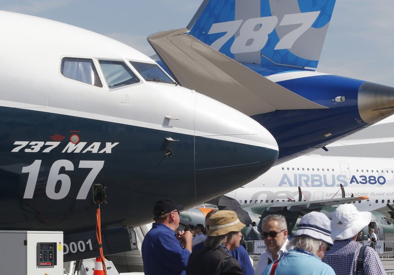 FILE - In this June 20, 2017, file photo Boeing planes displayed at Paris Air Show, in Le Bourget, east of Paris, France. Uncertainty over a Boeing jet and apprehension about the global economy hover over the aircraft industry as it prepares for next week's Paris Air Show. (AP Photo/Michel Euler, File)