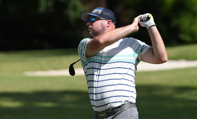 NWA Democrat-Gazette/J.T. WAMPLER Alex Neal watches a drive Sunday June 16, 2019 during the 81st Chick-A-Tee golf tournament at Springdale Country Club.