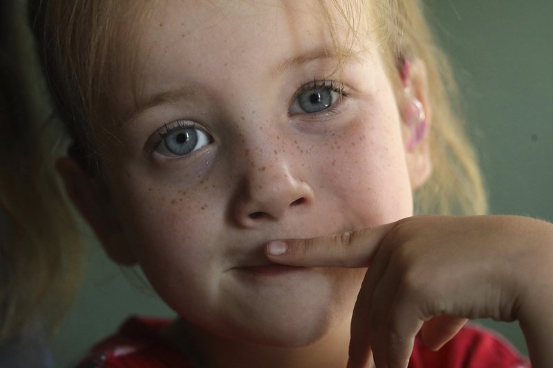 Victory poses at home, in Ogden, Utah, in this June 6 photo. The child has XXY chromosomes. She also has a separate condition that means her body doesn't fully respond to male hormones. Photo by Rick Bowmer via AP Photo