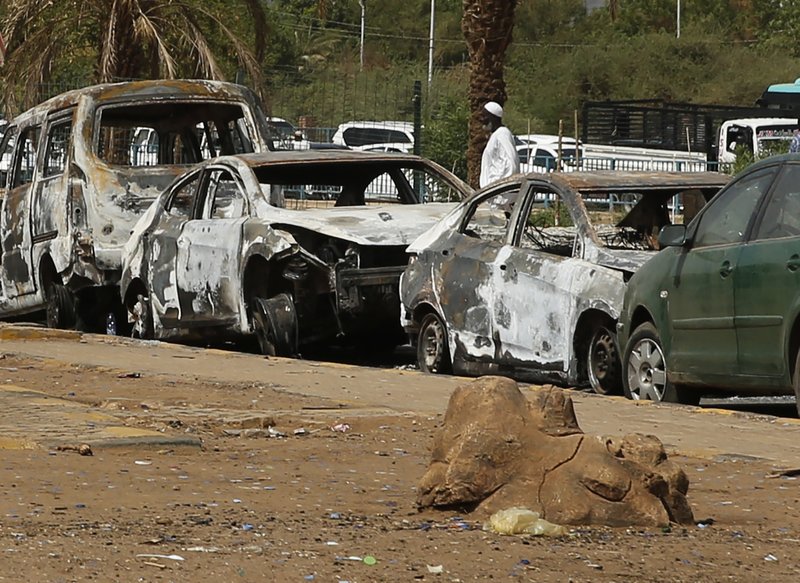 The Associated Press DEMONSTRATIONS: Burned cars remain at the square where the military cleared the opposition sit-in camp on June 3, in Khartoum, Sudan, Monday. Sudan's protest leaders called Monday for nighttime demonstrations and marches in the capital, Khartoum, and elsewhere in the country, amid a tense standoff with the ruling military.