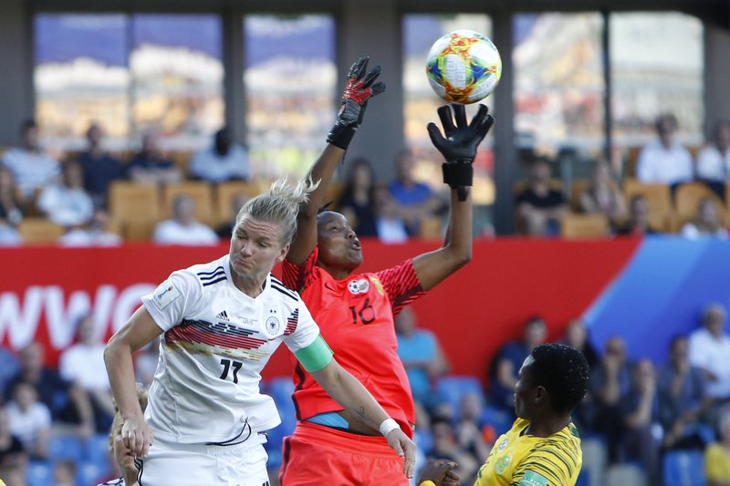 South Africa goalkeeper Andile Dlamini, center, catches the ball against Germany's Alexandra Popp during the Women's World Cup Group B soccer match between South Africa and Germany at the Stade de la Mosson in Montpellier, France, Monday, June 17, 2019. (AP Photo/Claude Paris)