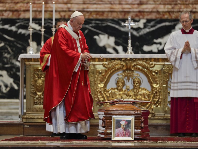 Pope Francis blesses the coffin as he celebrates the funeral service of Cardinal Leon Kalenga Badikebele, the Apostolic nuncio in Argentina, in St. Peter's Basilica at the Vatican, Saturday, June 15, 2019. (AP Photo/Gregorio Borgia)