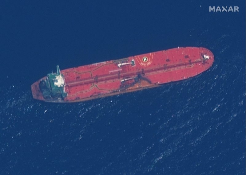 This satellite image provided by Maxar Technologies shows the oil tanker Front Altair off the coast of Fujairah, United Arab Emirates, Monday, June 17, 2019. New satellite photos released Monday show two oil tankers apparently attacked in the Gulf of Oman last week. The U.S. alleges Iran used limpet mines to strike the two tankers. Iran has denied being involved. (Satellite image &#xa9;2019 Maxar Technologies via AP)